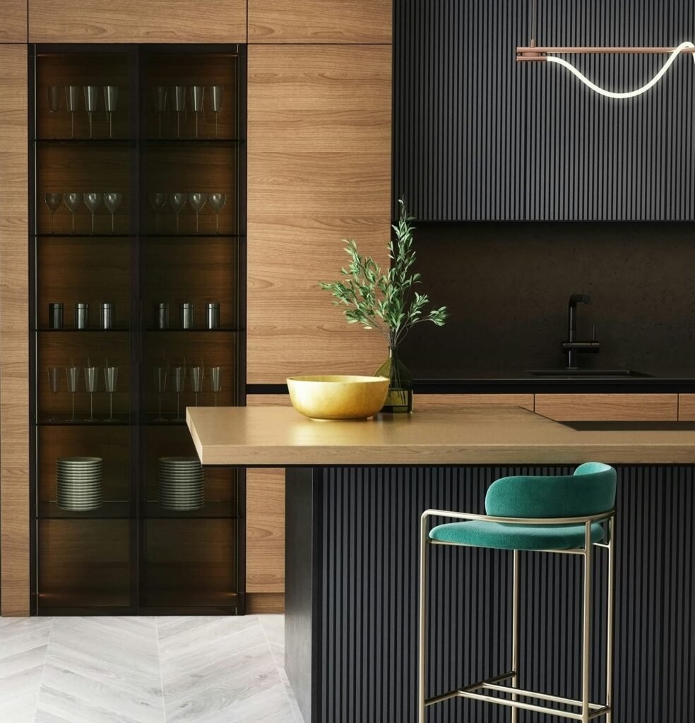 Modern kitchen interior with wooden cabinets, black fluted panels, glass display cabinet and island counter, interior design in Lahore